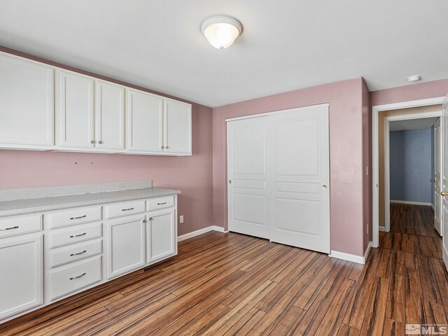 1343 White Bluffs Cir, Fernley, NV 89408 - kitchen featuring baseboards, white cabinetry, and dark wood-style flooring