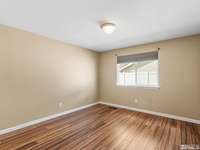 1343 White Bluffs Cir, Fernley, NV 89408 - empty room with baseboards and wood finished floors