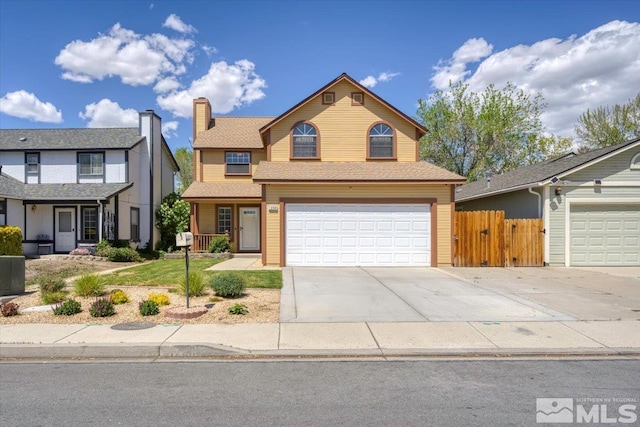 1280 O Callaghan Dr, Sparks, NV 89434 - traditional home with fence, a garage, driveway, and a chimney