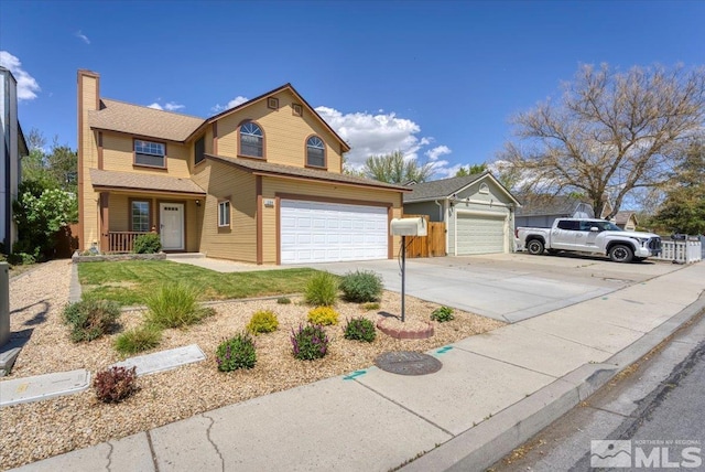 1280 O Callaghan Dr, Sparks, NV 89434 - traditional-style house featuring concrete driveway, covered porch, a chimney, a garage, and a front lawn