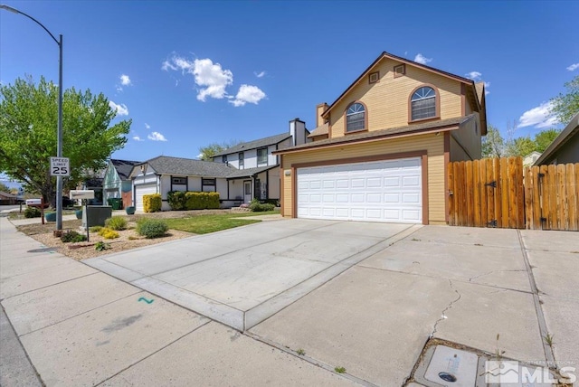 1280 O Callaghan Dr, Sparks, NV 89434 - traditional-style house with an attached garage, fence, and concrete driveway