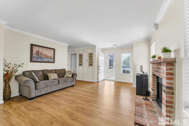 1280 O Callaghan Dr, Sparks, NV 89434 - living room with crown molding, light wood finished floors, a brick fireplace, and baseboards
