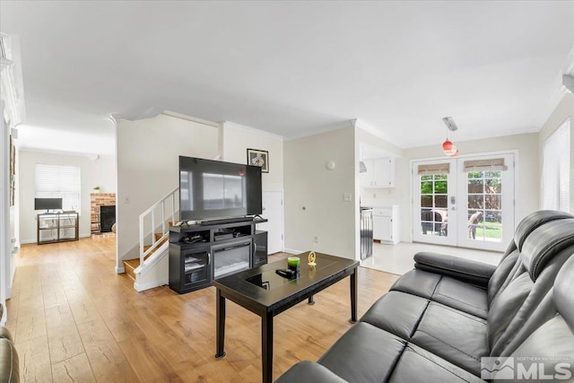 1280 O Callaghan Dr, Sparks, NV 89434 - living area featuring light wood finished floors, stairs, french doors, ornamental molding, and baseboards
