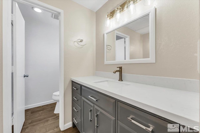 1280 O Callaghan Dr, Sparks, NV 89434 - bathroom with wood finished floors, vanity, toilet, and baseboards