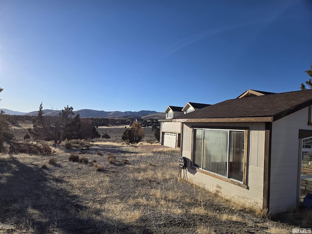 1250 Columbia Hill Rd, Reno, NV 89508 - view of yard with a garage and a mountain view