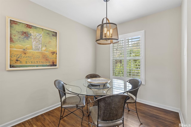 823 Arbutus St, Reno, NV 89509 - dining area featuring a chandelier, baseboards, and wood finished floors