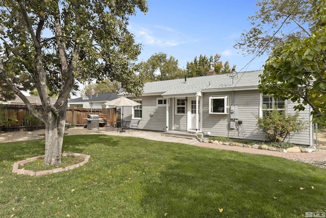 823 Arbutus St, Reno, NV 89509 - back of property featuring a patio, a shingled roof, a chimney, and entry steps