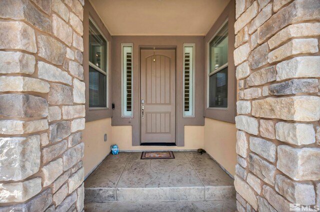 16885 Majestic View Dr, Reno, NV 89521 - entrance to property featuring stone siding and stucco siding