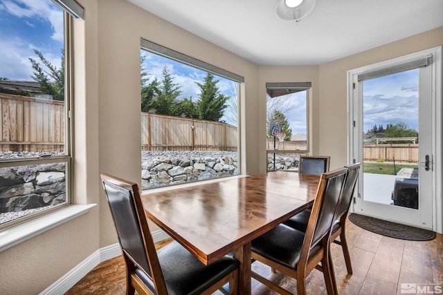 16885 Majestic View Dr, Reno, NV 89521 - dining area with plenty of natural light, baseboards, and light wood-type flooring