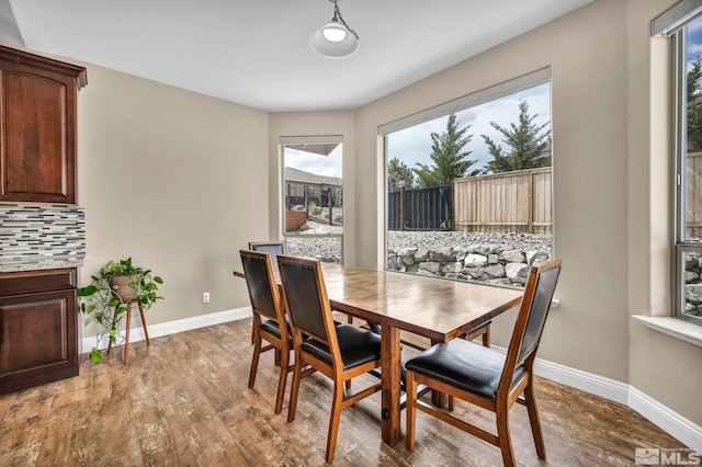 16885 Majestic View Dr, Reno, NV 89521 - dining room with healthy amount of natural light, baseboards, and wood finished floors