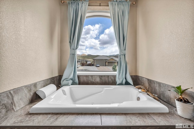 16885 Majestic View Dr, Reno, NV 89521 - full bathroom featuring a jetted tub and a textured wall