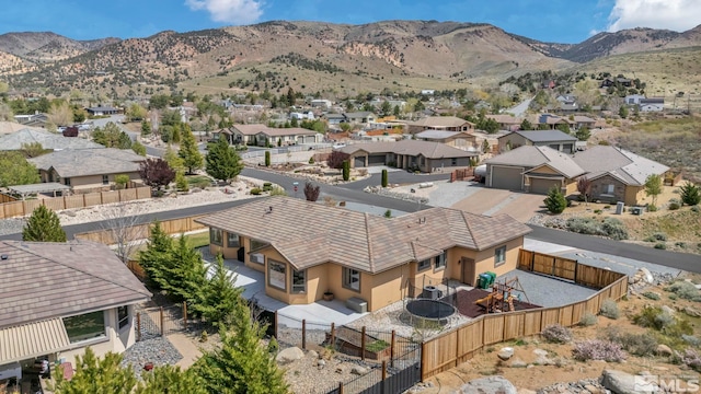 16885 Majestic View Dr, Reno, NV 89521 - aerial perspective of suburban area featuring a mountainous background