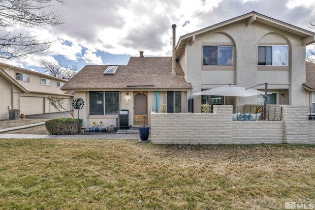 40 Condor Cir, Carson City, NV 89701 - view of front facade featuring stucco siding, roof with shingles, and a garage