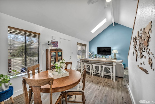 40 Condor Cir, Carson City, NV 89701 - dining area featuring a skylight, wood finished floors, baseboards, and plenty of natural light
