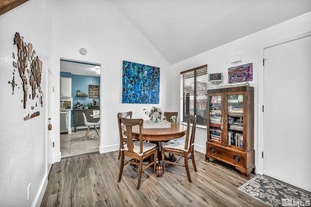 40 Condor Cir, Carson City, NV 89701 - dining room with wood finished floors, baseboards, and high vaulted ceiling