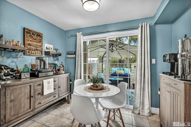 40 Condor Cir, Carson City, NV 89701 - dining space featuring light tile patterned floors and a textured ceiling