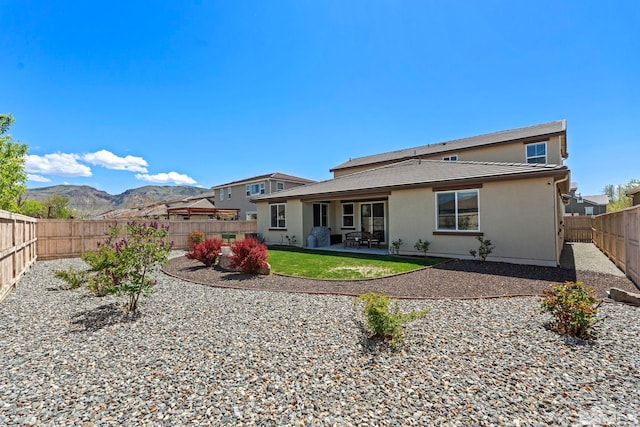 1845 Fledge Creek Dr, Reno, NV 89521 - rear view of property featuring a patio, a fenced backyard, and stucco siding
