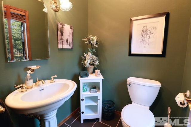 1300 Douglas Fir Dr, Reno, NV 89511 - half bathroom with toilet, tile patterned floors, and baseboards