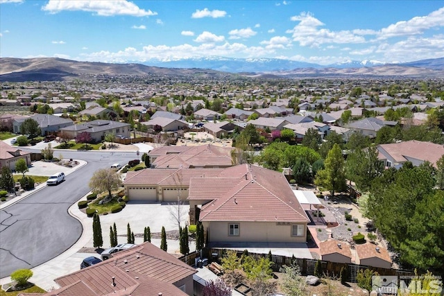 aerial perspective of suburban area with a mountainous background