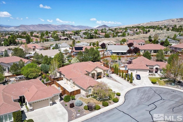aerial view of residential area with a mountainous background