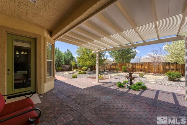 view of patio featuring a pergola and a fenced backyard