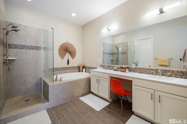 3335 Show Jumper, Reno, NV 89521 - full bathroom featuring a shower stall, a bath, double vanity, wood finished floors, and recessed lighting