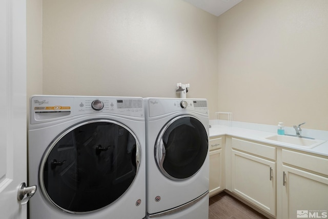 3335 Show Jumper, Reno, NV 89521 - laundry area featuring independent washer and dryer, cabinet space, and wood finished floors