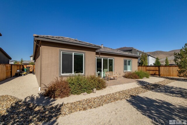 3335 Show Jumper, Reno, NV 89521 - rear view of property featuring a patio area, stucco siding, and a fenced backyard