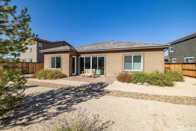 3335 Show Jumper, Reno, NV 89521 - back of property featuring fence, a patio area, and stucco siding
