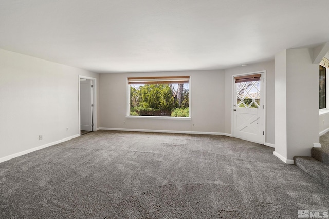 9499 Wigwam Way, Reno, NV 89506 - unfurnished living room with carpet flooring, baseboards, and stairs