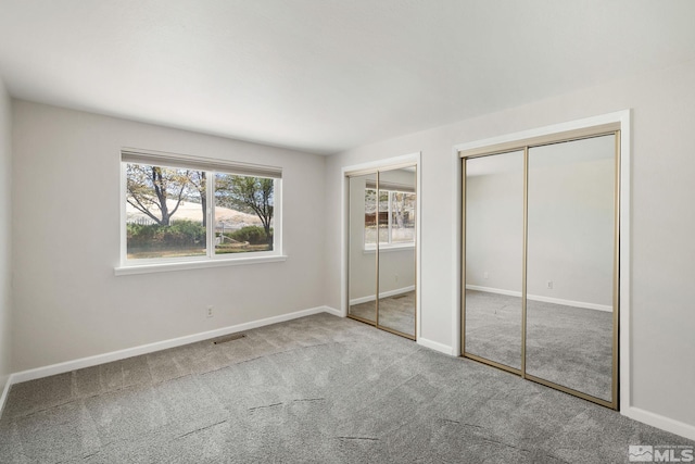 9499 Wigwam Way, Reno, NV 89506 - unfurnished bedroom with multiple closets, carpet, and baseboards