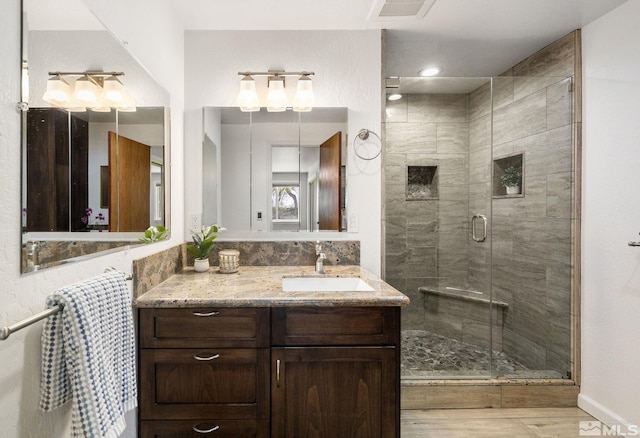 9499 Wigwam Way, Reno, NV 89506 - full bath featuring a shower stall, vanity, and wood finished floors