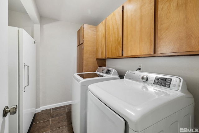 9499 Wigwam Way, Reno, NV 89506 - clothes washing area featuring cabinet space, washer and clothes dryer, and baseboards