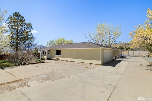 9499 Wigwam Way, Reno, NV 89506 - view of front facade with a garage, fence, and driveway