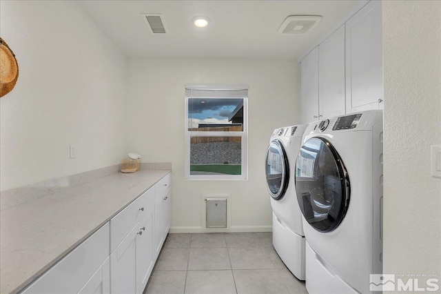 286 Greywall Ct, Dayton, NV 89403 - laundry area with washer and clothes dryer, cabinet space, light tile patterned floors, and baseboards