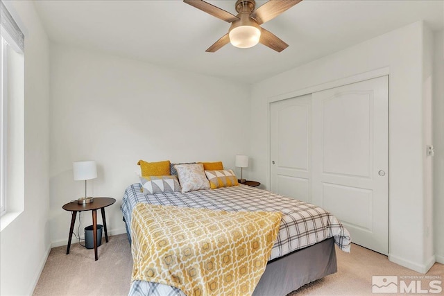 286 Greywall Ct, Dayton, NV 89403 - bedroom featuring light carpet, baseboards, a closet, and a ceiling fan