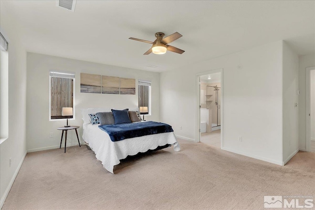 286 Greywall Ct, Dayton, NV 89403 - bedroom with light colored carpet, baseboards, ensuite bath, and ceiling fan