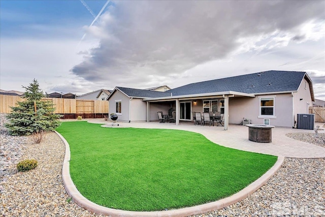 286 Greywall Ct, Dayton, NV 89403 - back of house with a fire pit, stucco siding, central AC unit, a patio area, and a shingled roof