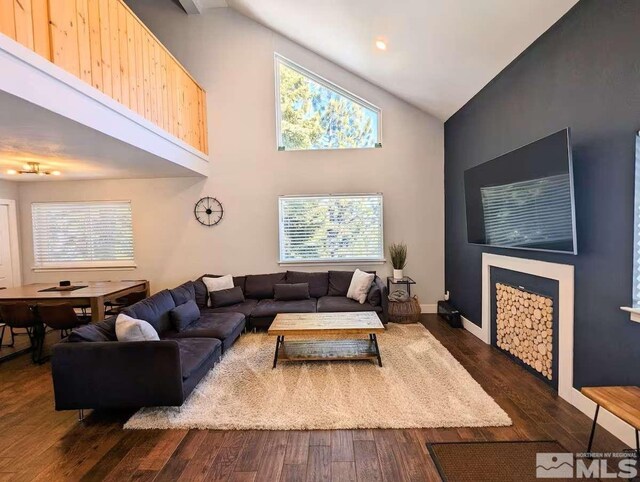 416 Quaking Aspen Ln Unit P, Stateline, NV 89449 - living room with high vaulted ceiling, dark wood-style flooring, and baseboards