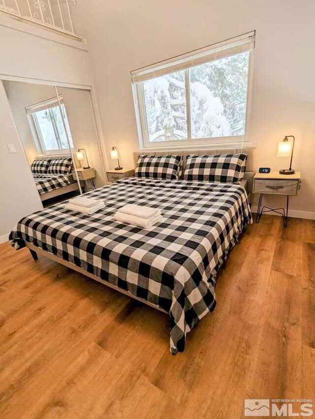416 Quaking Aspen Ln Unit P, Stateline, NV 89449 - bedroom featuring wood finished floors, baseboards, and a closet