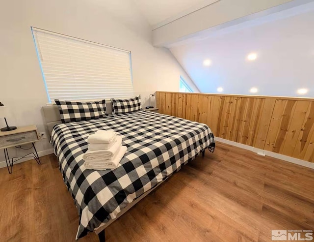416 Quaking Aspen Ln Unit P, Stateline, NV 89449 - bedroom featuring vaulted ceiling, wood finished floors, and baseboards
