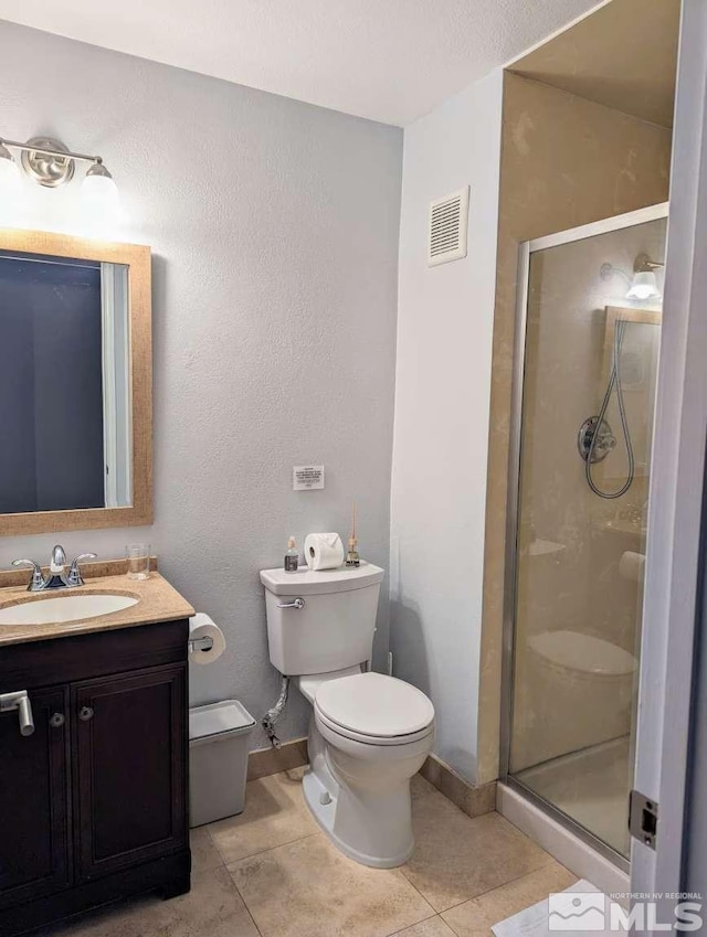 416 Quaking Aspen Ln Unit P, Stateline, NV 89449 - full bathroom featuring toilet, tile patterned floors, a stall shower, vanity, and baseboards