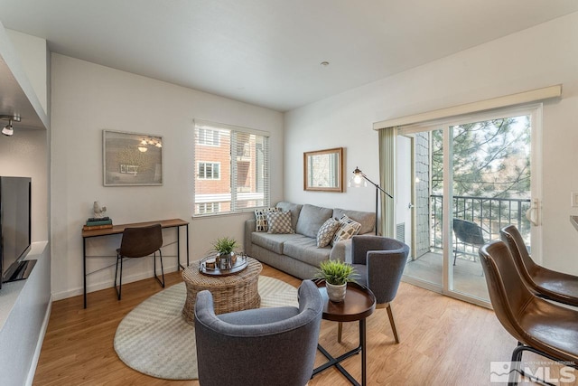 1450 Idlewild Dr Unit 1121, Reno, NV 89509 - living area with light wood-style flooring, plenty of natural light, and an office area
