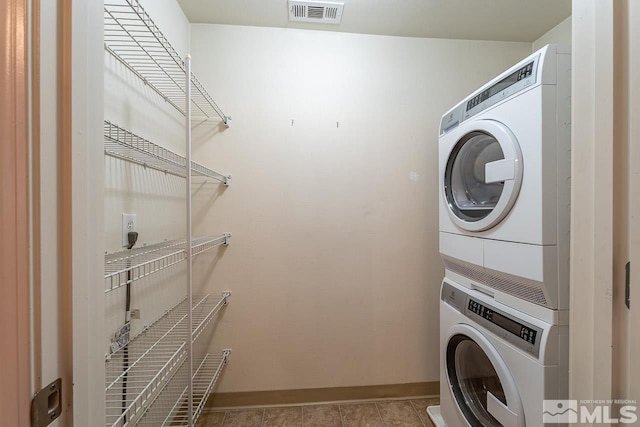 1450 Idlewild Dr Unit 1121, Reno, NV 89509 - laundry room with estacked washer and dryer and baseboards