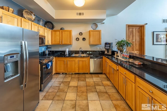 1450 Idlewild Dr Unit 1121, Reno, NV 89509 - kitchen with stainless steel appliances, a sink, and dark countertops