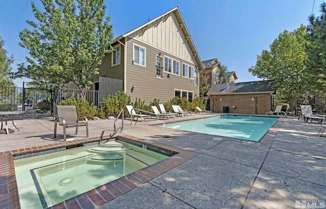 1450 Idlewild Dr Unit 1121, Reno, NV 89509 - community pool with a hot tub, a patio area, and fence