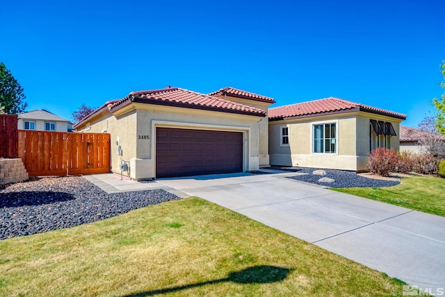 2485 Firenze Dr, Sparks, NV 89434 - mediterranean / spanish house with stucco siding, a garage, concrete driveway, and a tile roof