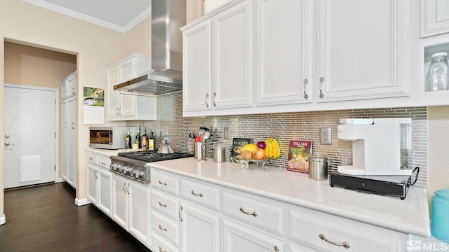2485 Firenze Dr, Sparks, NV 89434 - kitchen with wall chimney range hood, appliances with stainless steel finishes, ornamental molding, white cabinets, and decorative backsplash
