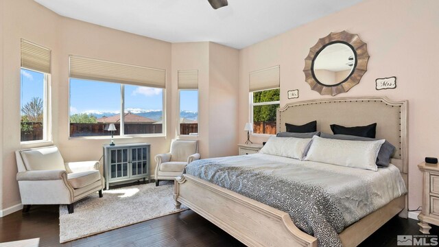2485 Firenze Dr, Sparks, NV 89434 - bedroom with dark wood-style floors and baseboards