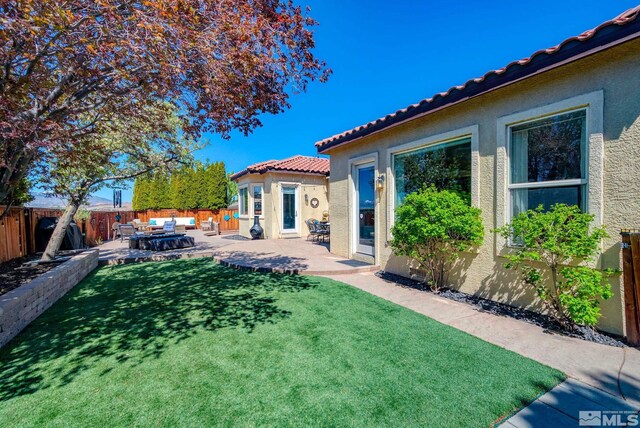 2485 Firenze Dr, Sparks, NV 89434 - view of yard featuring a patio area and an outdoor hangout area